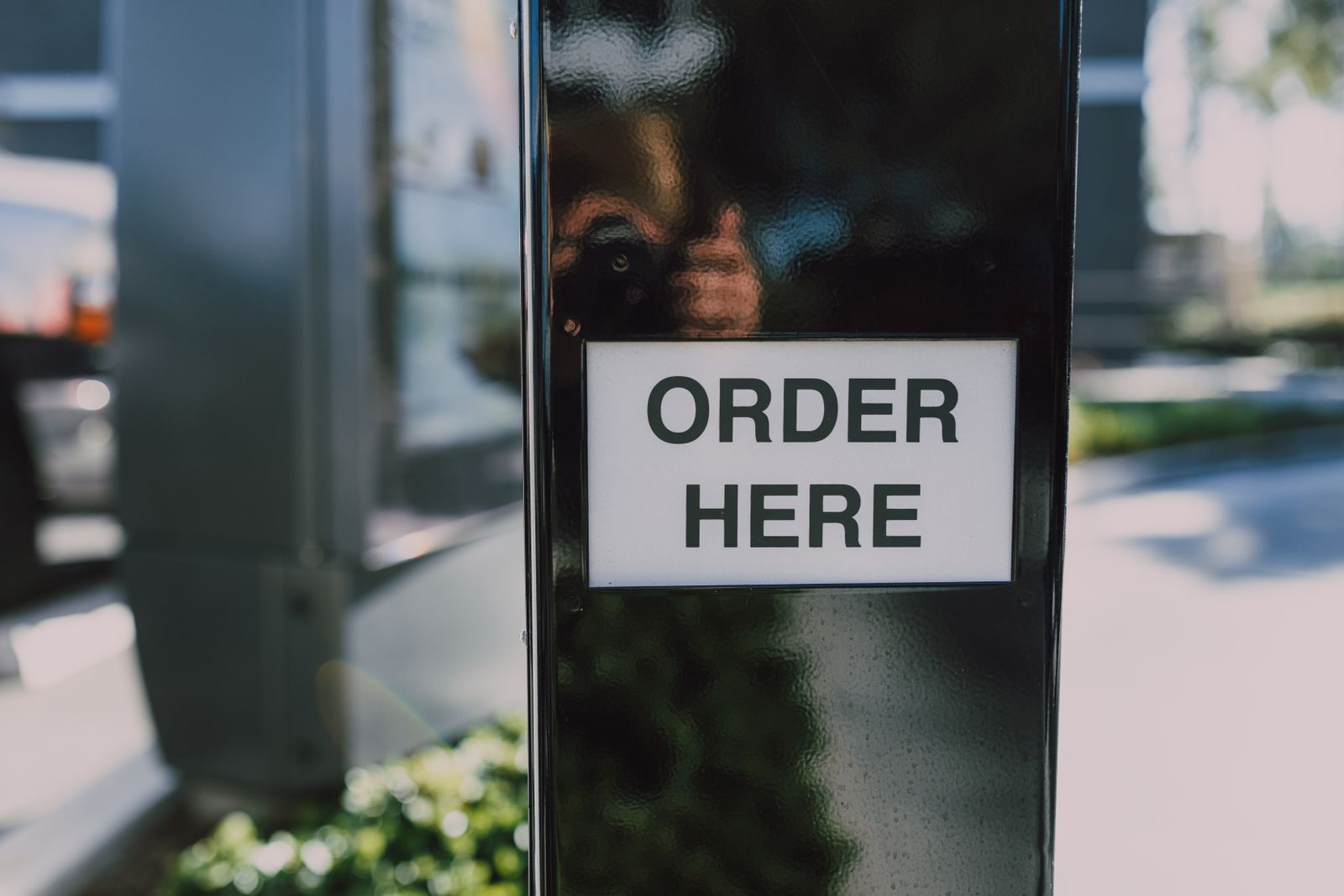 Close-up of a drive-thru order sign at a quick-service restaurant
