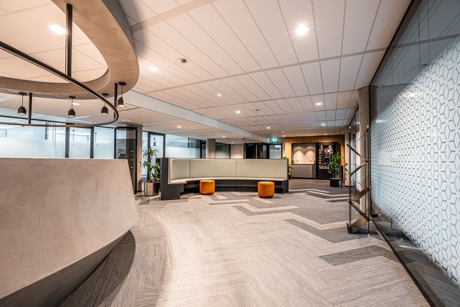 Spacious modern bank lobby with minimalist interior design and seating