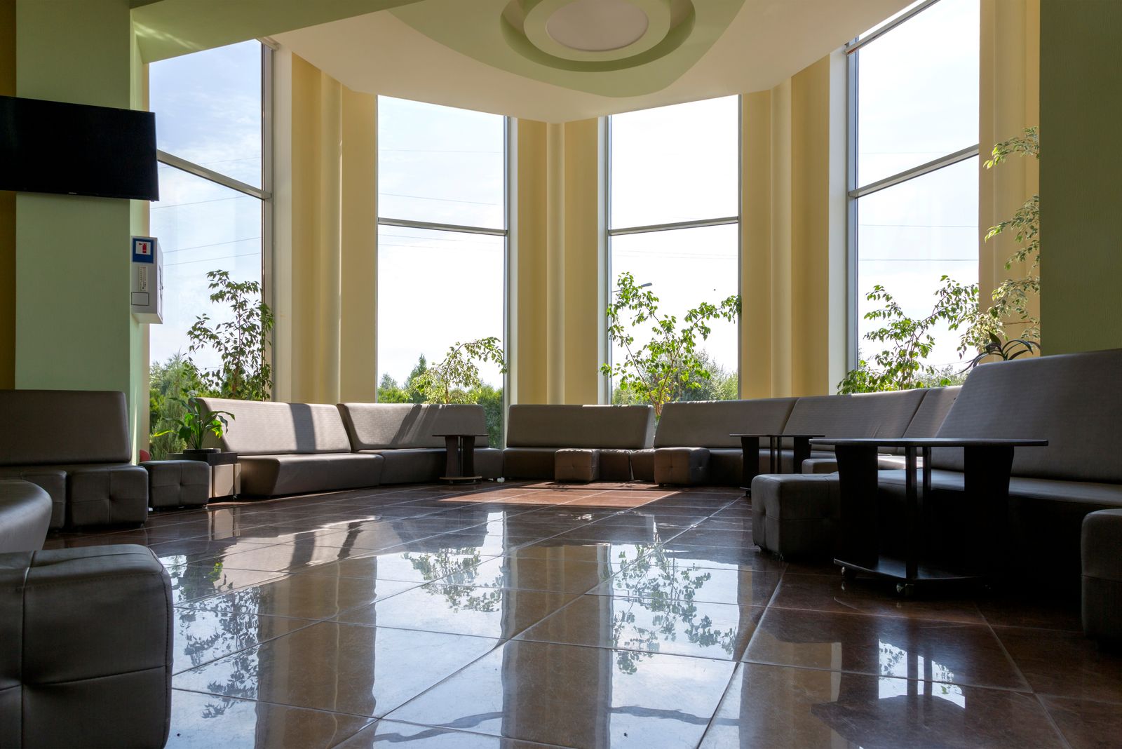 Spacious modern office lobby with natural light and seating