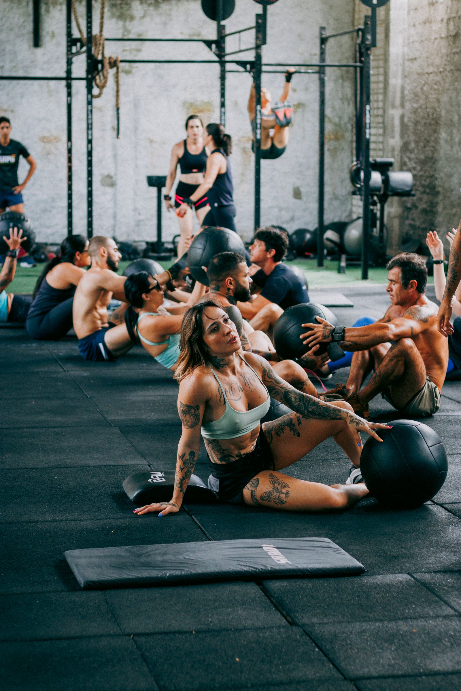 Group of adults training together in a fitness class indoors