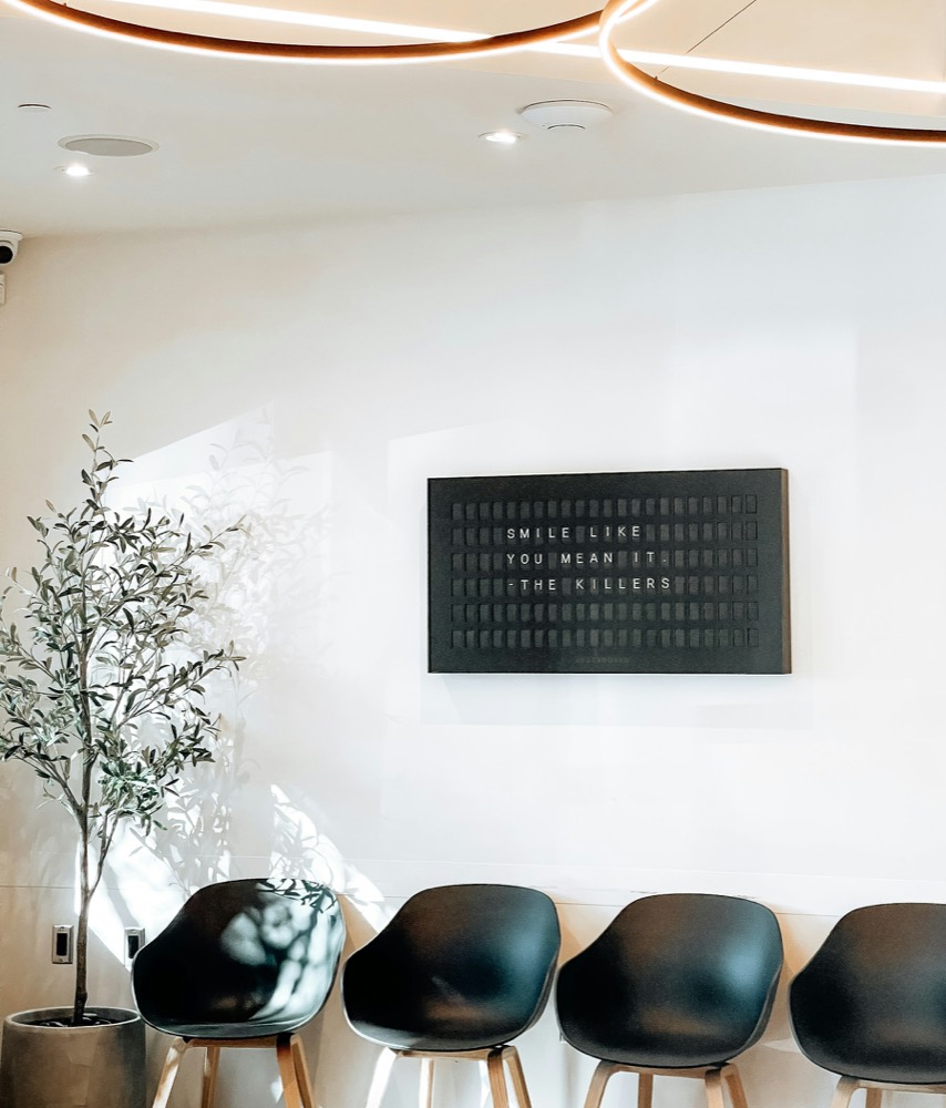 Bright modern clinic waiting room with seating
