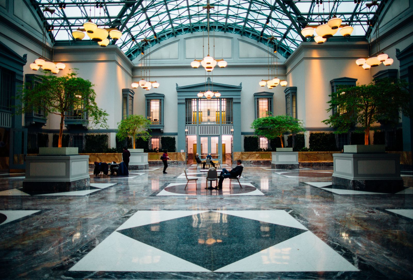 Spacious hotel lobby with modern architecture and elegant lighting