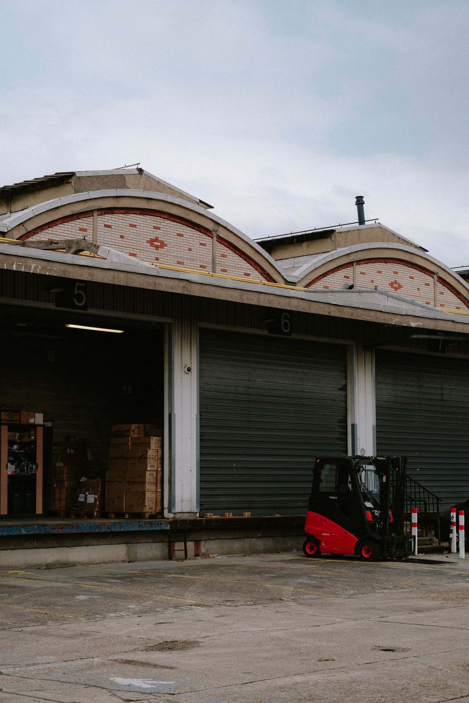 Forklift parked at a warehouse loading dock